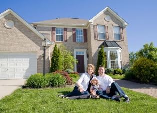 Family in Front of Their Home